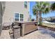 Exterior view of a hot tub on a stone patio next to the home with palm trees nearby at 5809 Oakbury Ct., Myrtle Beach, SC 29579