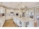Modern kitchen featuring white cabinets, a center island with seating, and stainless steel appliances at 5809 Oakbury Ct., Myrtle Beach, SC 29579