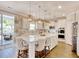 Bright and spacious kitchen with white cabinets, a large center island, and stainless steel appliances at 5809 Oakbury Ct., Myrtle Beach, SC 29579