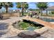 Beautiful backyard koi pond with waterfall, bridge and built in stone bench seating area and outdoor BBQ at 5809 Oakbury Ct., Myrtle Beach, SC 29579