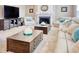 Spacious living room with cozy fireplace, comfortable seating, and stylish wood coffee tables at 5809 Oakbury Ct., Myrtle Beach, SC 29579