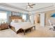 Bright main bedroom with a ceiling fan, access to the bathroom, and ample natural light at 5809 Oakbury Ct., Myrtle Beach, SC 29579