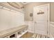 Well-organized mudroom with bench seating, coat hooks, and convenient access to the home at 5809 Oakbury Ct., Myrtle Beach, SC 29579
