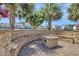 Entertain in your backyard with stone patio, built in seating, outdoor fireplace and tropical palm trees at 5809 Oakbury Ct., Myrtle Beach, SC 29579
