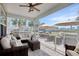 Screened patio with wicker seating and a view of palm trees at 5809 Oakbury Ct., Myrtle Beach, SC 29579