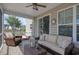 Relaxing screened patio with wicker seating and patterned cushions at 5809 Oakbury Ct., Myrtle Beach, SC 29579