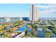Scenic aerial view of a coastal condominium complex with a beautiful pond and ocean views at 5905 Ocean Blvd. S # 1608, Myrtle Beach, SC 29577
