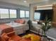Cozy living room featuring a bed with coral accents, a TV, and a comfortable seating area at 5905 Ocean Blvd. S # 1608, Myrtle Beach, SC 29577