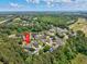 Stunning aerial view of the home nestled within a lush, wooded community near water and golf courses at 5916 Falcon Landing Circle, North Myrtle Beach, SC 29582