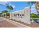 Elegant community sign for Barefoot Resort & Golf, surrounded by palm trees and brick accents at 5916 Falcon Landing Circle, North Myrtle Beach, SC 29582