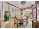 Formal dining room boasts hardwood floors, view of entry way and ornate hutch against wall at 5916 Falcon Landing Circle, North Myrtle Beach, SC 29582