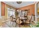 Formal dining room boasts hardwood floors and natural light from the window with coverings at 5916 Falcon Landing Circle, North Myrtle Beach, SC 29582