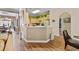 Bright kitchen with breakfast bar, open to the living area, and wood-look flooring at 5916 Falcon Landing Circle, North Myrtle Beach, SC 29582