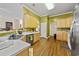 Well-lit kitchen with ample counter space, wooden cabinets, and modern appliances at 5916 Falcon Landing Circle, North Myrtle Beach, SC 29582