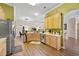 Spacious kitchen featuring wood cabinets, modern appliances, and an adjacent dining area at 5916 Falcon Landing Circle, North Myrtle Beach, SC 29582