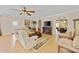 Inviting living area with neutral tones, fireplace, and seamless flow to the dining room at 5916 Falcon Landing Circle, North Myrtle Beach, SC 29582