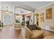 Open concept living room flows into the dining room and entryway with hardwood floors at 5916 Falcon Landing Circle, North Myrtle Beach, SC 29582