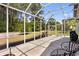 Bright and airy screened porch with serene views of the lush backyard, perfect for relaxation at 5916 Falcon Landing Circle, North Myrtle Beach, SC 29582