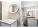 Bright bathroom features a dual vanity, decorative mirror, and shower/tub combo at 6001- 5718 S Kings Highway, Myrtle Beach, SC 29575