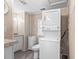 Cozy bathroom with combination washer and dryer appliance setup at 6001- 5718 S Kings Highway, Myrtle Beach, SC 29575