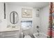 A white bathroom is equipped with neutral countertop vanity, toilet and shower/tub at 6001- 5718 S Kings Highway, Myrtle Beach, SC 29575