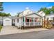Charming home boasting a covered front porch and inviting curb appeal at 6001- 5718 S Kings Highway, Myrtle Beach, SC 29575