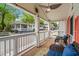 Inviting covered front porch with outdoor seating and views of the street and neighborhood at 6001- 5718 S Kings Highway, Myrtle Beach, SC 29575