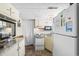 A functional kitchen features white appliances, a microwave, and countertops with available storage at 6001- 5718 S Kings Highway, Myrtle Beach, SC 29575