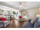 Open living room and dining area with wood floors, ceiling fan, and comfortable seating at 6001- 5718 S Kings Highway, Myrtle Beach, SC 29575