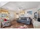 Inviting living room with a sofa, accent chair, TV, and natural light at 6001- 5718 S Kings Highway, Myrtle Beach, SC 29575
