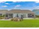 Spacious backyard with a well-maintained lawn and outdoor dining areas at 6076 Campanella St., Myrtle Beach, SC 29577