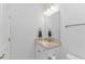 Well-lit bathroom featuring vanity with granite countertop, mirror, and white cabinets at 6076 Campanella St., Myrtle Beach, SC 29577