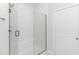 Modern walk-in shower with white subway tile surround and glass enclosure at 6076 Campanella St., Myrtle Beach, SC 29577