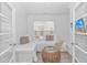 Bright bedroom area featuring natural light and an accent table at 6076 Campanella St., Myrtle Beach, SC 29577