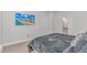 Bright bedroom featuring a comfortable bed and a wall-mounted television at 6076 Campanella St., Myrtle Beach, SC 29577