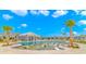 Resort-style community pool featuring in-water lounge chairs and swaying palm trees at 6076 Campanella St., Myrtle Beach, SC 29577