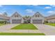 Charming exterior featuring well-kept lawns and symmetrical 2-car garages at 6076 Campanella St., Myrtle Beach, SC 29577
