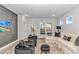 Bright living room with comfortable seating, modern decor, and access to outdoor patio at 6076 Campanella St., Myrtle Beach, SC 29577