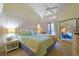 Bedroom boasts a window, a ceiling fan, light colored walls, and sliding door mirrored closet at 613 13Th Ave. S # 147, Surfside Beach, SC 29575