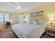 Comfortable bedroom with white bedding, fan and desk area perfect for a relaxing retreat at 613 13Th Ave. S # 147, Surfside Beach, SC 29575