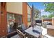 Relaxing patio area with an outdoor dining set, sun umbrella and sliding glass door at 613 13Th Ave. S # 147, Surfside Beach, SC 29575