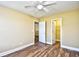 Bedroom boasts wood-look floors, neutral walls, and access to a walk-in closet and en-suite bathroom at 6172 Catalina Dr. # 214, North Myrtle Beach, SC 29582