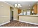 Cozy dining area with stylish chandelier and view into the adjacent kitchen at 6172 Catalina Dr. # 214, North Myrtle Beach, SC 29582