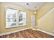 Bright entryway with wood floors, high ceiling, and natural light from large windows at 6172 Catalina Dr. # 214, North Myrtle Beach, SC 29582