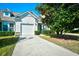 Charming home featuring a well-manicured lawn and a classic white garage door at 6172 Catalina Dr. # 214, North Myrtle Beach, SC 29582