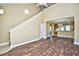 Spacious living room with wood floors, high ceiling, and open view to the kitchen at 6172 Catalina Dr. # 214, North Myrtle Beach, SC 29582