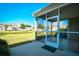 Cozy screened-in porch offering a peaceful outdoor retreat with neighborhood views at 6172 Catalina Dr. # 214, North Myrtle Beach, SC 29582