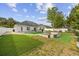Spacious backyard featuring a lawn, fire pit, and privacy fence at 649 W Perry Rd., Myrtle Beach, SC 29579