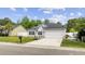 Charming single-Gathering home with a well-maintained lawn and a two-car garage at 649 W Perry Rd., Myrtle Beach, SC 29579