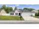 Charming single-story home featuring a well-manicured lawn, attached two car garage, and inviting curb appeal at 649 W Perry Rd., Myrtle Beach, SC 29579